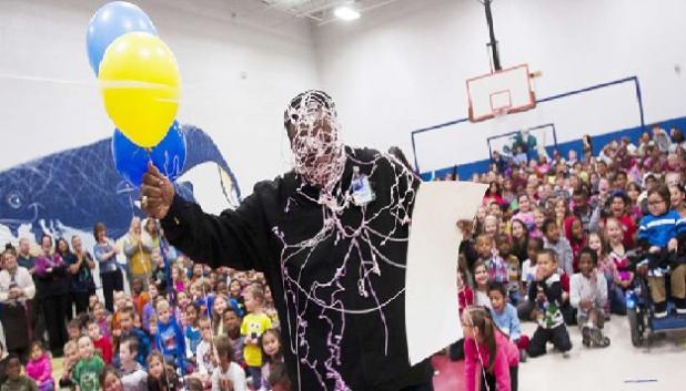 Ernest Sapp is coated in silly string as he accepts his grant monies from the Education Foundation Thursday morning. Sapp is an instructor at Fairview/Jewell and is one of 16 educators from the campus to receive a grant.