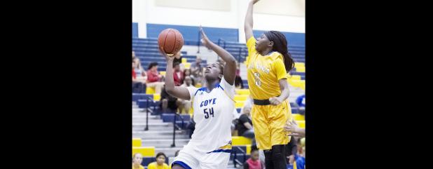 CCLP/TJ MAXWELL - Copperas Cove senior forward Chyanne Chapman shoots in front of La Vega freshman Tierney Sawyers during the Lady Dawgs’ 62-50 win over the Lady Pirates Tuesday in game one of a girl/boy doubler header at Bulldawg gymnasium. Chapman scored 19 points and snagged 10 rebounds in three quarters to lead the Lady Dawgs to victory.