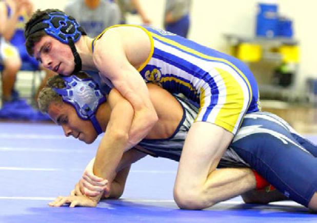 Copperas Cove’s Lane Teeter takes the back of Shoemaker’s Angel Rodriguez during their 113-pound matchup on Monday at Copperas Cove High School. Shoemaker edged out Cove with a 7-5 match win total. Ariel Lewis, Cory Smith, Lane Robinson and Adam Smalley also notched wins.