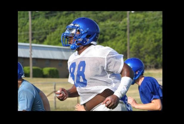 Copperas Cove defensive end Tyrell Thompson runs sprints during practice on Tuesday at the Copperas Cove athletic complex. Thompson hopes his defense will help lead the Bulldawgs to a deep playoff run in 2014-15.