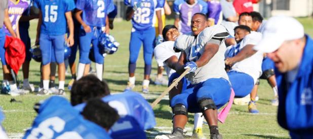 Members of the Copperas Cove defensive line, right, battle it out with members of the offensive line in a game of tug-o-war during spring practice at the school on Wednesday. The defense won the battle.