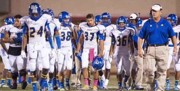 Copperas Coach head coach jack Welch leads his defense on the field during their game Friday against Belton. The Bulldawgs will host Ellison for senior night tonight.