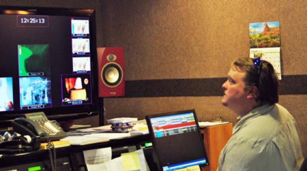 Copperas Cove resident and employee at KNCT Chuck McManus watches the screen that shows the programs being broadcast to PBS viewers across the Central Texas region.