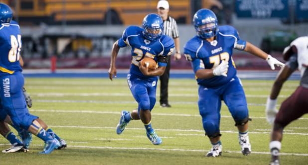 Copperas Cove senior running back Trent Canion runs through a huge hole opened by his offensive line in the first half of the Dawgs 62-38 win over A&M Consolidated Friday at Bulldawg Stadium.