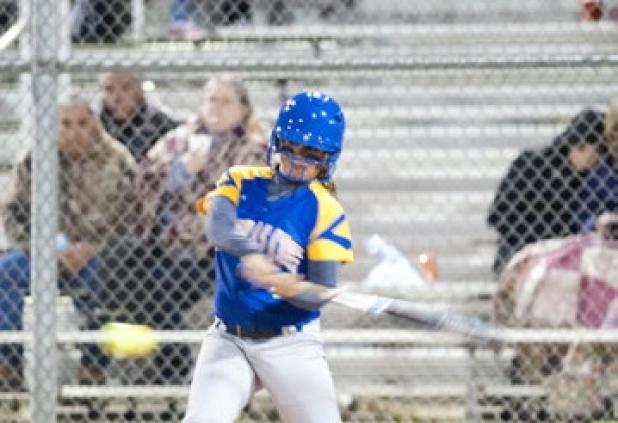 Carlee Duran turns on a pitch for a single during the Lady Dawgs’ victory over Shoemaker.