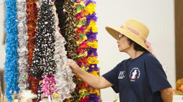 Shoo Chen Dean browses through the colorful scarves for sale