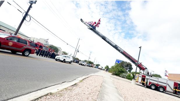 CCLP/LYNETTE SOWELL-STEVENS The prcesssion for Retired Deputy Fire Chief Mike Flaming passes in front of the Central Fire Station last. Friday morning. Fleming was remembered with a Celebration of Life service on Monday at Lea Ledger Auditorium.