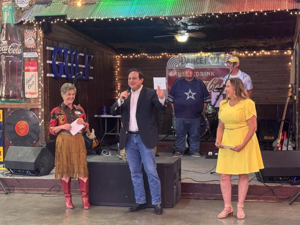 Steve Munisteri, senior advisor for the office of Governor Greg Abbott, speaks to the crowd at Boots & Bling.