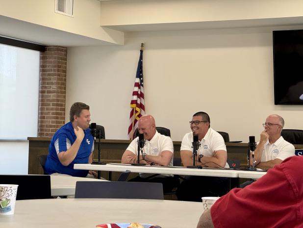 Head football coach Rodney Southern, second from left, chuckles during Tuesday's first recording session of "Southern Talk."