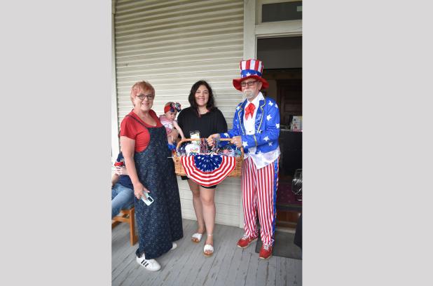John Gallen, dressed as Uncle Sam, awards a prize basket at last year’s 4th of July Celebration at Allin House. This year’s celebration is set for 10 a.m. until 2 p.m. on Saturday, July 4.