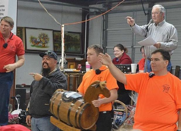 A bidding war ensues for a rocking horse that went for $95 at Saturday night’s auction and barbecue fundraiser at the Kempner Volunteer Fire Department.