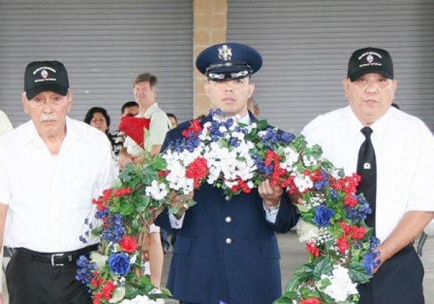 Officials from the Chomorro community deliver a wreath honoring their fallen during the 70th anniversary of the liberation of Guam.