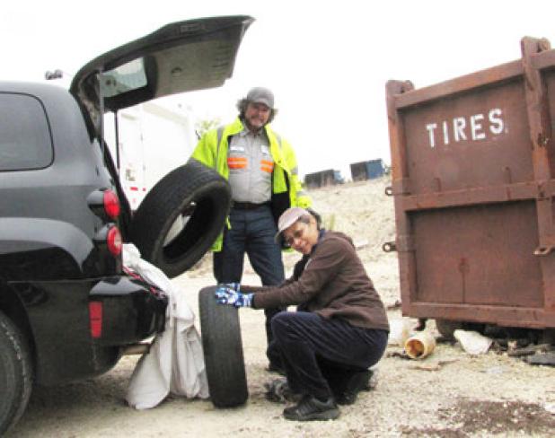 Diana Bohn disposed of several unwanted tires with the help of city worker, Jay Alexander. Tire disposal normally costs $3 or $7 depending on size, but Covites were allowed to dispose of them for free during Saturday’s fall cleanup.