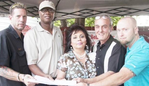 Liquor petition committee gathers around to commemorate the start of a new beginning at Dave’s Sports Bar and Grill Tuesday. (Left to Right) Dave McBride, Mitch Lofton, Joyce Hauk, George Duncan, and Chris Polidoro.