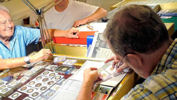 Coins are individually inspected at an Antique Pickers coin event. Coins For Cash is at VFW Post #8577 this week to purchase coins, gold, silver, collectibles and more.