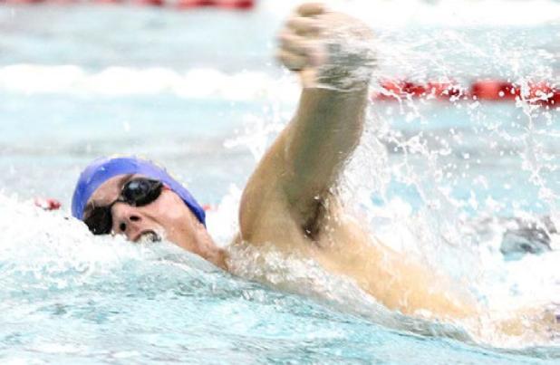 Cove senior Kyle Helmer competes in the 200-yard freestyle relay during the District 12-6A swim meet Saturday at the Clements Boys and Girls Club in Killeen. Helmer qualified for regionals in the 50 freestyle, 200 medley relay, 200 freestyle relay and 400 freestyle relay.