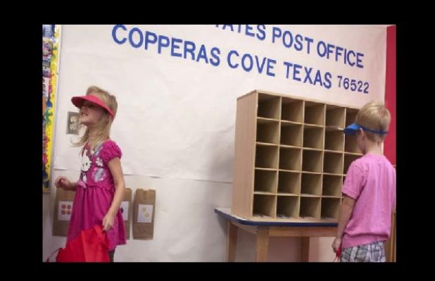 Students from Robyn Petet’s Pre-K class put their sorting skills to the test as they deliver mail inside their post office. Students mailed letters to their home to learn about the postal process.