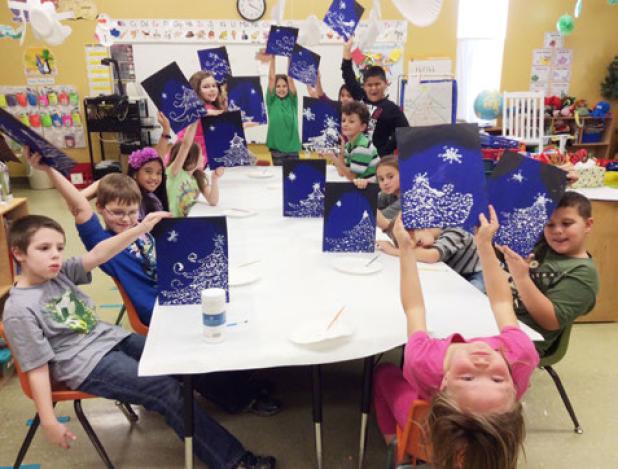 Members of the Martin Walker Elementary School art club created holiday works
of art using the technique of pointillism. Teacher Sharon Cecil is the club advisor.