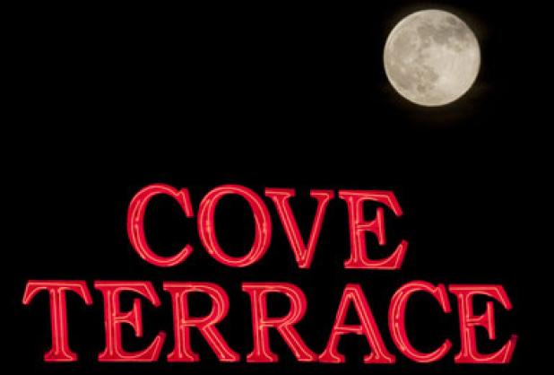 A Supermoon rises over the cove Terrace Shopping center Sunday evening. The Supermoon appeared 20 percent closer than normal.