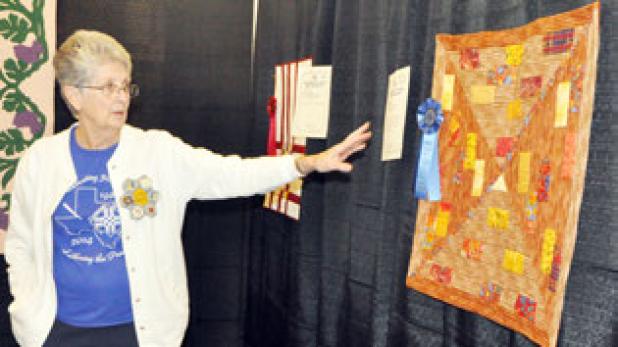 Joyce Mayor talking about the Guild Color Challenge at the Shades of Texas Quilt Show.