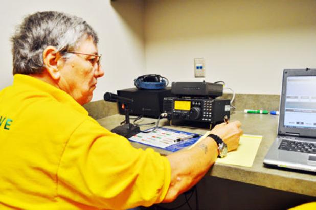 Ted Bruski, a Copperas Cove ham radio operator, writes down a call sign from another operator in Florida at Saturday’s Amateur Radio Relay League field day.