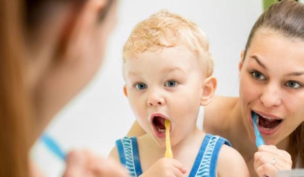 Teaching children to brush at a young age helps improve the habit of keeping the pearly whites healthy.