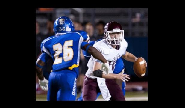 Copperas Cove defenders Michael Sumrall (26) and Tyrell Thompson harass A&M Consolidated quarterback Mason Hickson in the first half of the Dawgs 62- 38 win Friday at Bulldawg Stadium.
