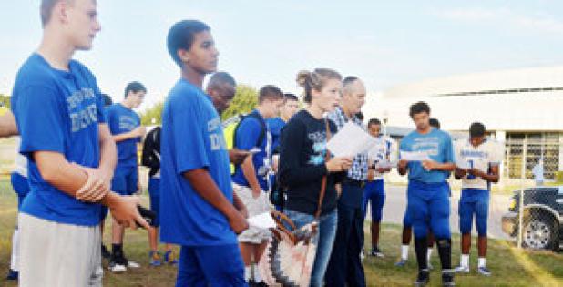 Students from Copperas Cove High School worship during the annual See you at the Pole Wednesday.
