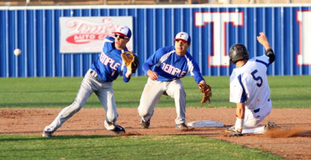 Copperas Cove senior Bryce Delano slides into second base as Temple’s Reid Hesse and Ricky Ortiz await the throw during the first inning of Friday’s game at Temple. The Wildcats edged the Bulldawgs 4-2.