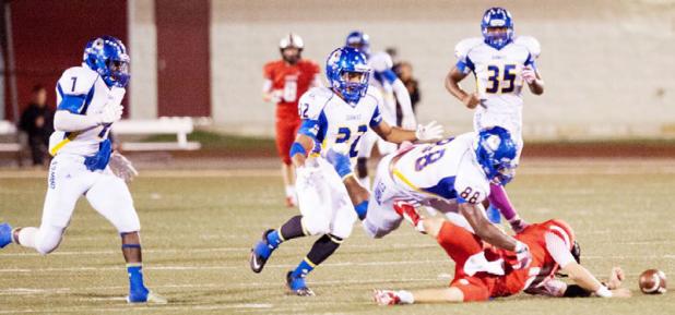 Copperas Cove senor defensive end Tyrell Thompson (88) prevents Belton quarterback Shane Stafford from recovering a bad snap in the fourth quarter as senior linebacker Justin Joe (7) charges in for the scoop and score. The Bulldawg defense scored 14 points in their 42-21 win over Belton on Friday. Jaylen Waters (35), shown in background, had a scoop and score in the second period. Thompson forced both turnovers.