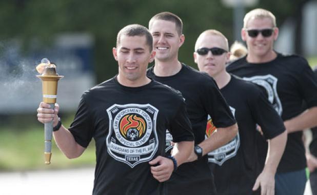 Officer Jacob Smith leads the Copperas Cove Police Department during the annual Law Enforcement Torch Run for Special Olympics.