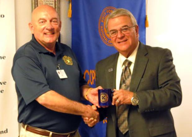 Mark Peterson, left, presents Marc Nigliazzo President of Texas A&M University Central Texas with an Exchange Club mug following his presentation Wednesday morning.