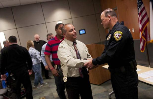 Copperas Cove Police Sgt. Martin Ruiz congratulates Immanuel Pedroza on his graduation and joining the police force following a swearing in ceremony Friday afternoon.