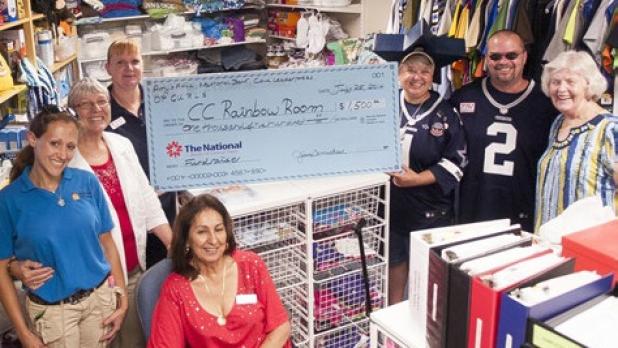The Coryell County Rainbow Room recently accepted a check to the sum of $1,500 from volunteers who held a carwash and auction for their benefit. Gloria Schmitz, seated, Leah Hrncir, second from left and Janie French, far right, maintain and provide necessities to the children who enter the foster system from the Rainbow Room.