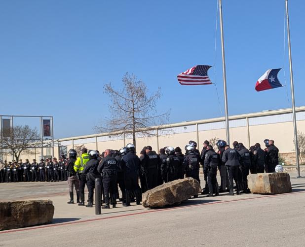 Dozens of law enforcement agencies stand outside the Cadence Bank Center, where services were held for slain Copperas Cove police officer Elijah Garretson on Jan. 17.