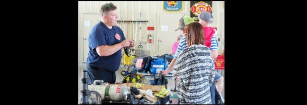 CCLP/J.S. FREDERICK - Firefighter/Paramedic John Burgan explains the equipment to citizens as they take a tour of Central Fire Station Saturday morning. Partnering with Benny Boyd of Lampasas the department raised more than $4,800 during the open house.