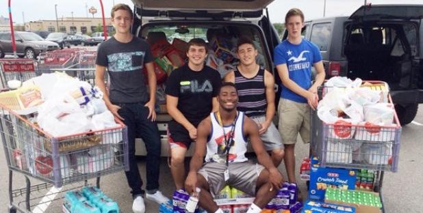 Members of the Copperas Cove DECA program pose with a portion of the 500 pounds collected during their backpacks food drive at Wal-Mart on Saturday. The collection will keep the shelves stocked through December.