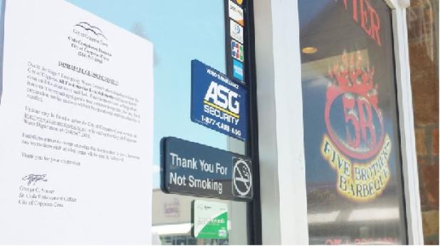 Local restaurants were asked to close their doors on Sunday and Monday to conserve water following an interruption in service of the main water line from BCWCD No. 1. A letter from Code Enforcement hangs on the entryway to Five Brothers Barbeque notifying customers of the immediate closure notice.