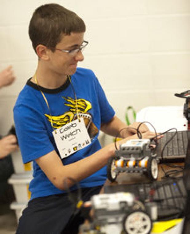 Halstead fifth grader Caleb Welch programs his robot as he prepares to participate in the third annual Copperas Cove ISD robotics challenge
on the Fairview/Miss Jewell campus Saturday.