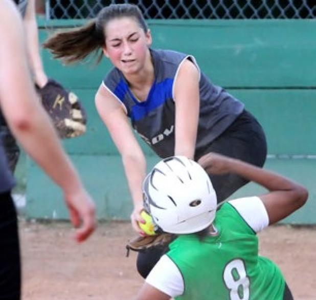 15-under Cove HSE’s Talulah Cross tags out Marissa Walls at home plate during their Copperas Cove Parks and Recreation league game on Wednesday at the city park ball fields.