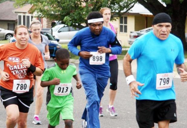 A group of runners make their way through the neighborhoods of Copperas Cove as they take part in the annual 5K Gallop or Trot sponsored by H-E-B Plus!