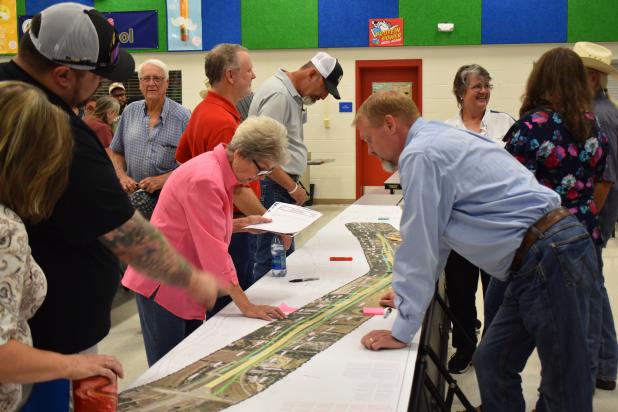 File Photo -- Local residents check out the I-14 expansion at a prior public meeting. This month, three will be held in Copperas Cove, Lampasas, and Lometa. 
