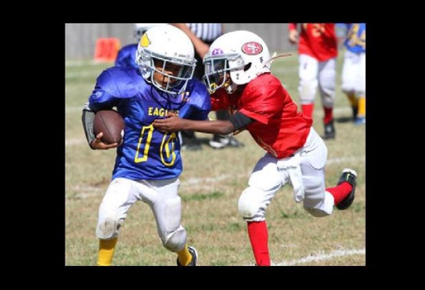 Eagles running back Mateo Sobers eludes the tackle of 49ers defender Malik Davis during their semifinal matchup on Saturday. The Eagles defeated the 49ers 12-0 to earn a spot in Thursday’s Championship game against the Longhorns.