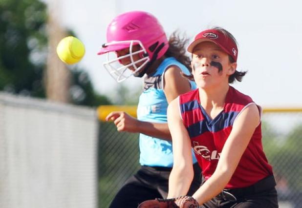 10U Diamondbacks third baseman Brooklyn Thompson waits on the throw as Marlins’ Jayna Carrero safely reaches base during their Copperas Cove Parks and Recreation league game Wednesday at city park.