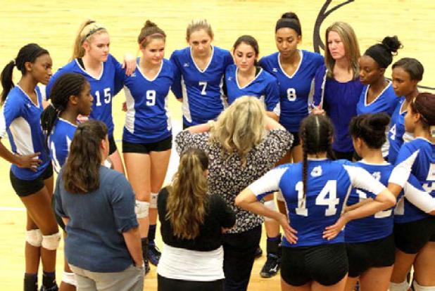 Copperas Cove head coach Cari Lowery talks to her squad during a timeout against Killeen last Tuesday. Their wins over Killeen and Harker Heights secured their second-place spot heading into the postseason .The Lady Dawgs finish out their district slate against Belton tonight.