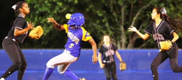 Copperas Cove junior Zhianna Johnson (2) beats out the flip from Timberview’s Nala Stokes to Alex Taylor during Game 1 of their best-of-three series on Friday at the Waco ISD Softball Complex. Timberview won thes eries 2-0.