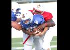 CCLP/TJ MAXWELL - Former Copperas Cove defensive lineman Martinez Rogers wraps up Blue Team quarterback Hunter Parrish of Goldthwaite during the eighth annual Fellowship of Christian Athletes Victory Bowl on Saturday. Rogers had four tackles and one sack for the Red Team in the 7-6 loss.