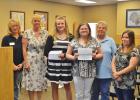 CCLP/LYNETTE SOWELL  Mikayla Miller and Delaney Brown receive $500 scholarship checks from Keep Copperas Cove Beautiful at Tuesday night's city council workshop.