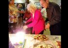 CCLP/PAMELA GRANT - Surrounded by friends and family, Cove’s oldest living resident, Edna Teinert, pre-pares to blow out the candles on her 106th birthday cake.