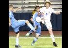 CCLP/TJ MAXWELL - Cove senior captain Billy Horton (6) battles for possession against China Spring on Tuesday.